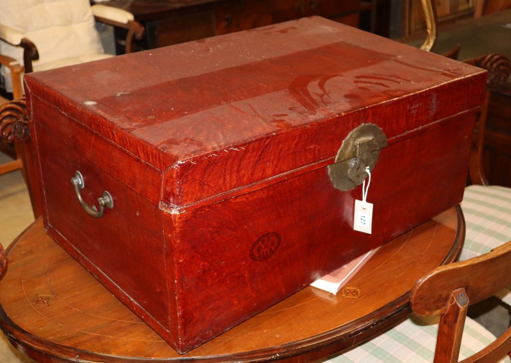 A Chinese red lacquer pigskin trunk, c.1900, W.79cm, D.52cm, H.37cm