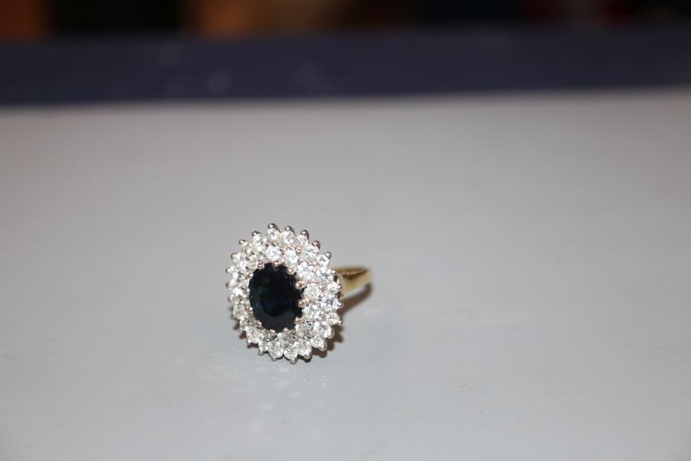 A modern 18ct gold, sapphire and diamond set oval cluster ring, size L, gross 7 grams.CONDITION: - Image 3 of 3