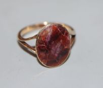 A 9ct and bluejohn set oval ring, size M, gross 2.7 grams.CONDITION: Stone has several cracks and