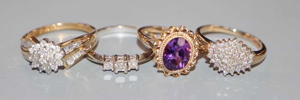 Three assorted modern 9ct gold and diamond set dress rings and a 9ct gold and amethyst ring, gross