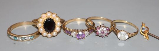 Five assorted modern 9ct gold and gem set dress rings, gross 10.9 grams and a 15ct gem set stick