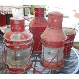 Three painted ships lanterns and two fire buckets, largest lantern 56cm high