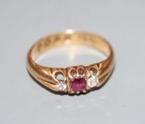 A late Victorian 18ct gold, ruby and diamond three stone ring, size I, gross 3 grams.CONDITION: A