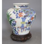 A 19th century Chinese wucai vase, wood stand, height 28cmCONDITION: There are two star cracks to