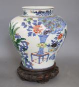 A 19th century Chinese wucai vase, wood stand, height 28cmCONDITION: There are two star cracks to