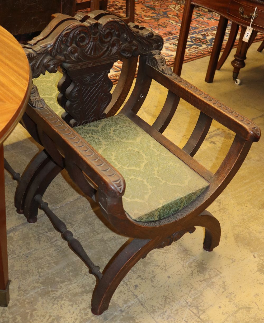 A set of four early 20th century carved oak X-frame chairs, W.61cm, D.58cm, H.76cm - Image 2 of 2