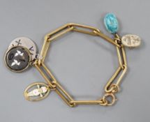 An 18ct bracelet, hung with five assorted charms, gross 33 grams.