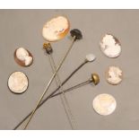 Four assorted mounted metal hatpins including amethyst and six carved cameo shells, five