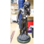 A bronze of a boy holding a stick with bird, height 71cm