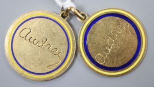 Two yellow metal and enamel pendant medallions, both engraved 'Audrey', 26mm, gross 14.9 grams.