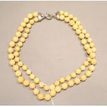 A 20th century double strand graduated facetted hardstone necklace with 925 clasp, 60cm.