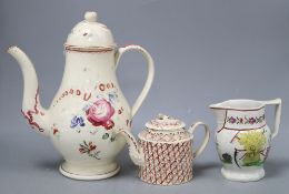 A late 18th century Leeds type creamware coffee pot and cover, an enamelled teapot and cover and a