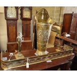 Four brass items, comprising a student's lamp, a table lamp, a 'grape pannier' stick stand and a