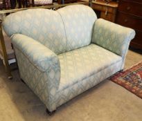 An early 20th century drop arm two seater settee, W.134cm, D.80cm, H.80cm