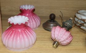A pair of Victorian oil lamp glass shades, one with reservoir