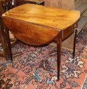 A George III mahogany oval Pembroke table, W.90cm, D.54cm, H.74cmCONDITION: The top is ring marked