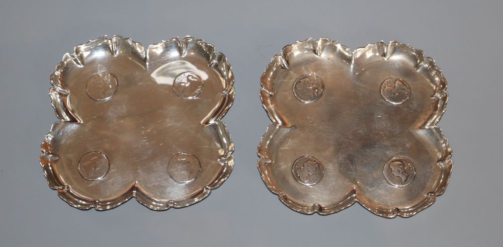 A pair of Victorian silver coin inset quatrefoil dishes, F.B. Thomas & Co, London, 1888, 11cm, gross