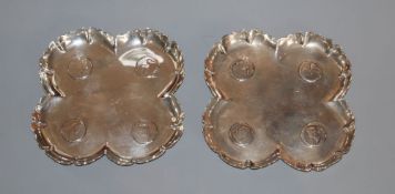A pair of Victorian silver coin inset quatrefoil dishes, F.B. Thomas & Co, London, 1888, 11cm, gross