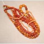 Three assorted necklaces- amberoid, glass and coral, largest 74cm.