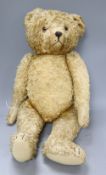 A vintage gold plush teddy bear