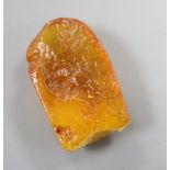 An amber pebble fragment, 51mm, 18.6 grams.