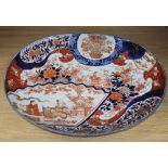 An Imari oval charger, width 62cmCONDITION: There is a large hairline crack vertically from the