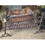 Three wrought iron fire baskets and a pair of dogs, largest basket W.70cm
