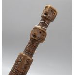 A geometric carved tribal walking cane, c.1840, length 100cm