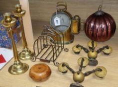 A 19th century brass ship's compass, a pair of brass candlesticks, a three branch wall sconces and a