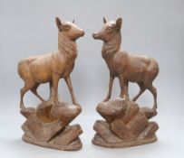 A pair of Black Forest carved deer, c.1860, height 34cm