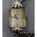 A lady's stainless steel Omega manual wind wrist watch, on associated bracelet.CONDITION: Case
