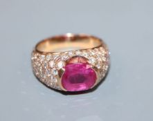 A yellow metal, ruby and diamond encrusted dress ring, size O, gross 11.3 grams.CONDITION: Ruby size