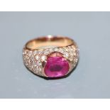 A yellow metal, ruby and diamond encrusted dress ring, size O, gross 11.3 grams.CONDITION: Ruby size