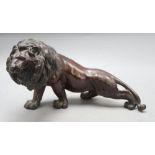A Japanese bronze lion, length 35cm