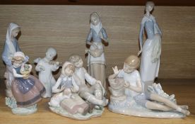 Five Lladro figures, a Nao figure and a Miquel Requena figure, comprising Boy with bird on a tree