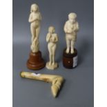 Three carved ivory figures and a parasol handle carved as a hoof, tallest 16.5cm