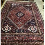 A Caucasian geometric red ground carpet, 320 x 230cm