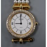 A lady's 18ct gold, seed pearl and diamond set Van Cleef and Arpels quartz bracelet watch, 17.5cm,