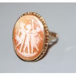 An early 20th century 9ct gold and 'Three Graces' carved oval cameo shell ring, size R, gross 3.5