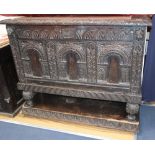 An 18th century and later carved oak fall front cabinet, (altered) W.127cm, D.51cm, H.104cm