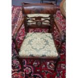 A set of six Regency gilt metal mounted mahogany dining chairs, (two with arms)