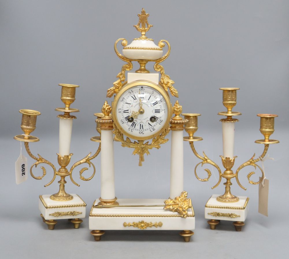 A 19th century French gilt metal and white marble clock garniture, overall height 40.5cm