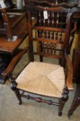 A set of eight 19th century North West Area spindle back rush seat chairs, two with arms