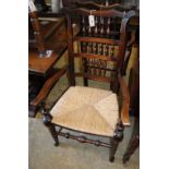 A set of eight 19th century North West Area spindle back rush seat chairs, two with arms