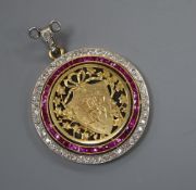 An early 20th century pierced yellow metal, ruby and diamond set circular sweethearts pendant,