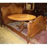 A Louis XV style carved walnut double bed frame, W.140cm, L.204cm