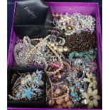 A group of assorted costume jewellery including rings, brooches, necklaces, etc.