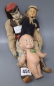 A vintage Kewpie doll and two others