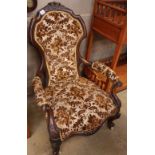 A Victorian rosewood spoon back open armchair