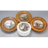 Three Prattware pot lids in oak frames and another Prattware pot